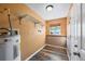 A laundry room with storage shelves and luxury vinyl plank flooring at 2412 Giddens Ave, Seffner, FL 33584