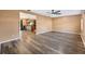 A spacious living room with hardwood floors opens to the kitchen with an island at 2412 Giddens Ave, Seffner, FL 33584