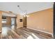 Open concept living room features wood floors and abundant natural light at 2412 Giddens Ave, Seffner, FL 33584