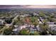 Aerial view of the property in a neighborhood with mature trees and convenient access to amenities at 2887 North Rd, Clearwater, FL 33760
