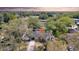 Aerial view highlights the home's new roof, walkway and the mature trees creating a private setting at 2887 North Rd, Clearwater, FL 33760