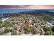 This aerial perspective shows the home nestled in a community with convenient access to the bay and a scenic bridge at 2887 North Rd, Clearwater, FL 33760