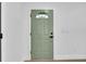 Interior view of sage colored front door featuring modern hardware at 2887 North Rd, Clearwater, FL 33760
