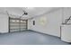 A spacious garage with new floor paint, garage door, water heater and a bright window at 2887 North Rd, Clearwater, FL 33760