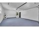 Attached garage with water heater and a dark door at 2887 North Rd, Clearwater, FL 33760