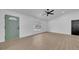 Open floorplan of living space with luxury vinyl plank flooring and sage-colored door at 2887 North Rd, Clearwater, FL 33760