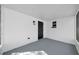 Small screened in room with painted floors and white walls at 2887 North Rd, Clearwater, FL 33760