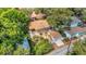 Aerial view of home with a pergola, detached garage and fenced-in yard at 3026 51St S St, Gulfport, FL 33707