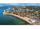 Breathtaking aerial shot of the waterfront community, showcasing the sandy beach and sparkling ocean at 3026 51St S St, Gulfport, FL 33707