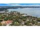 A serene aerial view capturing the home's proximity to the waterfront in a lush, green area at 3026 51St S St, Gulfport, FL 33707