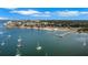 Picturesque aerial view of a coastal community with sailboats on the water and a long pier at 3026 51St S St, Gulfport, FL 33707