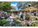 Inviting backyard patio with a cozy seating area, lush greenery, and charming decorative elements at 3026 51St S St, Gulfport, FL 33707