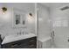 Modern bathroom featuring sleek vanity, elegant lighting and glass enclosed shower at 3026 51St S St, Gulfport, FL 33707