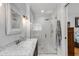 Modern bathroom featuring marble vanity, elegant lighting and glass enclosed shower at 3026 51St S St, Gulfport, FL 33707