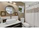 Stylish bathroom featuring a vessel sink, subway tile backsplash, and shower at 3026 51St S St, Gulfport, FL 33707