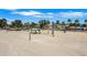 Expansive white sand beach with multiple volleyball nets and shaded picnic areas at 3026 51St S St, Gulfport, FL 33707