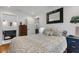 Comfortable bedroom with en suite bathroom, hardwood floors and white walls at 3026 51St S St, Gulfport, FL 33707