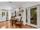 Charming dining room with hardwood floors, a dining table, and bright windows bringing in natural light at 3026 51St S St, Gulfport, FL 33707