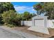 A detached garage with a new concrete driveway and gated access is perfect for extra storage or a workshop at 3026 51St S St, Gulfport, FL 33707