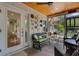 Cozy screened-in lanai with comfortable seating and a wood ceiling with backyard views at 3026 51St S St, Gulfport, FL 33707