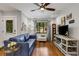 Bright living room boasts wood floors, contemporary furnishings, and abundant natural light at 3026 51St S St, Gulfport, FL 33707