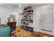Bright office space with custom bookshelf and unique area rug at 3026 51St S St, Gulfport, FL 33707