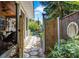 Private side yard featuring stone pavers, garden border and access to a screened in porch at 3026 51St S St, Gulfport, FL 33707