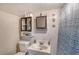 Bathroom features built-in shelves and a light blue shower curtain at 3515 18Th E St, Bradenton, FL 34208