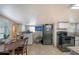 Kitchen featuring tile flooring, wooden table and black appliances at 3515 18Th E St, Bradenton, FL 34208