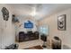 Rec room with a large television, butterfly art and neutral paint at 3515 18Th E St, Bradenton, FL 34208