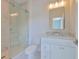 Bathroom featuring a glass shower, marble countertops, and updated vanity at 3913 W Euclid Ave, Tampa, FL 33629