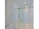 Modern bathroom with subway tiles, glass enclosed shower and nice tile flooring at 3913 W Euclid Ave, Tampa, FL 33629