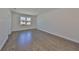 Sunlit bedroom with hardwood floors and ample natural light, providing a welcoming and spacious atmosphere at 3913 W Euclid Ave, Tampa, FL 33629