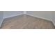 A bright bedroom boasts hardwood floors and white trim, creating a clean and modern aesthetic at 3913 W Euclid Ave, Tampa, FL 33629