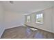 Bright bedroom features wood floors and natural light from large windows at 3913 W Euclid Ave, Tampa, FL 33629