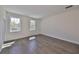 Bright bedroom features wood floors and natural light from large windows at 3913 W Euclid Ave, Tampa, FL 33629