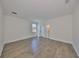 Spacious bedroom features hardwood floors, natural light, and an en suite bathroom, providing comfort and convenience at 3913 W Euclid Ave, Tampa, FL 33629