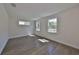 Bright, spacious bedroom features wood floors and plenty of natural light from two windows at 3913 W Euclid Ave, Tampa, FL 33629