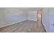 Bright bedroom showcases hardwood floors, ample space, and neutral walls, ready for personalization and comfort at 3913 W Euclid Ave, Tampa, FL 33629