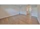 An open bedroom features hardwood floors, abundant natural light, and an en suite bathroom, providing comfort and convenience at 3913 W Euclid Ave, Tampa, FL 33629