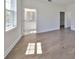 Bedroom with hardwood flooring, natural light, view into adjacent bathroom at 3913 W Euclid Ave, Tampa, FL 33629