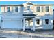 Charming two-story home featuring light gray siding, white trim, and an attached two-car garage at 3913 W Euclid Ave, Tampa, FL 33629