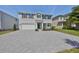 Charming two-story home with a paved driveway and well-manicured landscaping at 3913 W Euclid Ave, Tampa, FL 33629