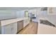 Modern kitchen with a stainless steel refrigerator, center island, and a gas range at 3913 W Euclid Ave, Tampa, FL 33629
