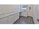 Well-appointed laundry room with marbled countertops, ample cabinet space, and sleek, stylish tile flooring at 3913 W Euclid Ave, Tampa, FL 33629