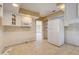 Bright kitchen featuring white cabinets, a microwave, and a modern LG refrigerator at 3933 Doral Dr, Tampa, FL 33634