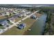 Impressive aerial view of waterfront homes, boasting canal access and well-manicured lawns at 4010 Jewfish Dr, Hernando Beach, FL 34607