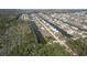 Serene aerial shot of waterfront houses with canal access, complemented by the rich greenery at 4010 Jewfish Dr, Hernando Beach, FL 34607