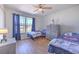 Bedroom with window and ceiling fan, complemented by neutral walls and decor at 4010 Jewfish Dr, Hernando Beach, FL 34607