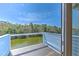 Deck overlooking lush green waterfront views at 4010 Jewfish Dr, Hernando Beach, FL 34607